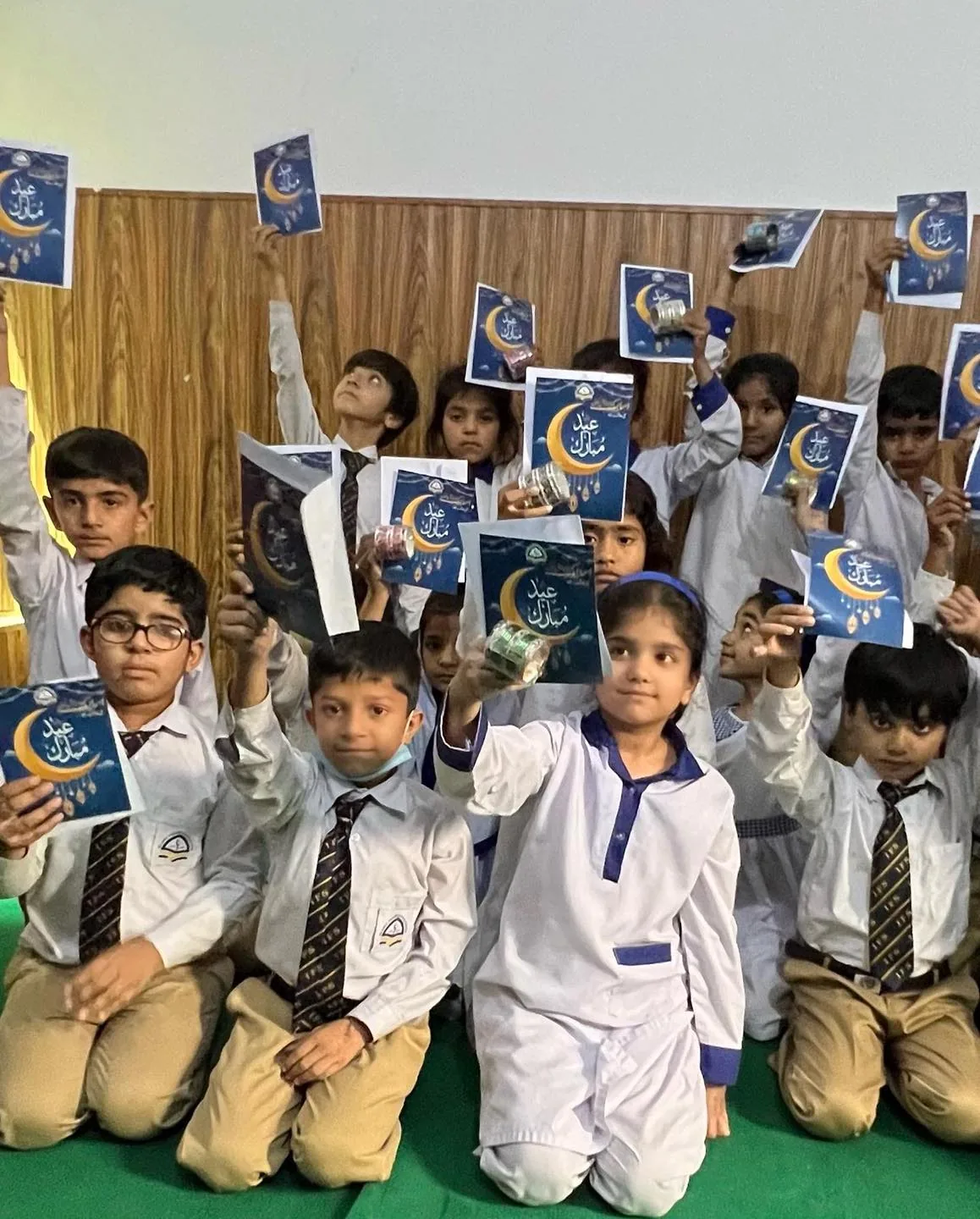 Happy students celebrating together at school